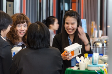 Pretty researcher explain her work to customerのeditorial素材