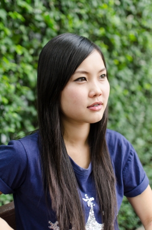 Asian girl, in a gardenの写真素材