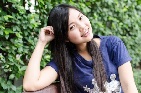 Asian girl, in a gardenの写真素材