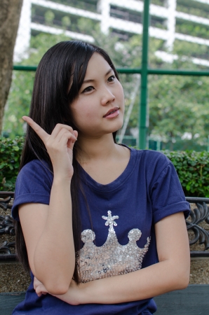 Lovely Chinese girl in the gradenの写真素材