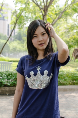 Lovely Chinese girl in the gradenの写真素材