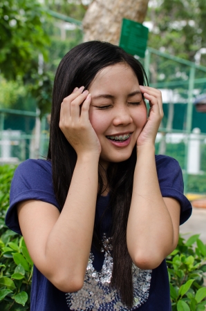 Lovely Chinese girl in the gradenの写真素材