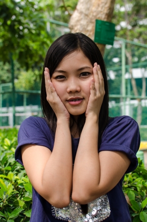 Lovely Chinese girl in the gradenの写真素材