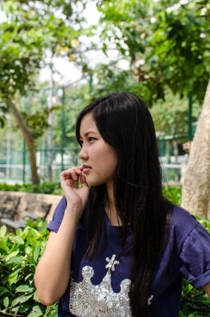 Lovely Chinese girl in the gradenの写真素材