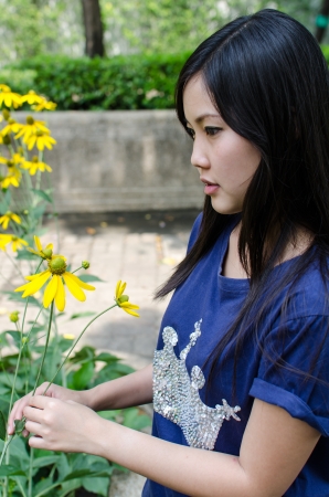 Lovely Chinese girl in the gradenの写真素材