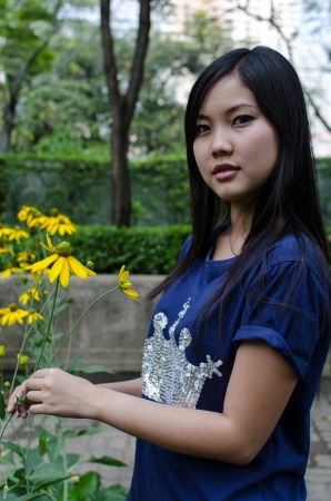 Lovely Chinese girl in the gradenの写真素材