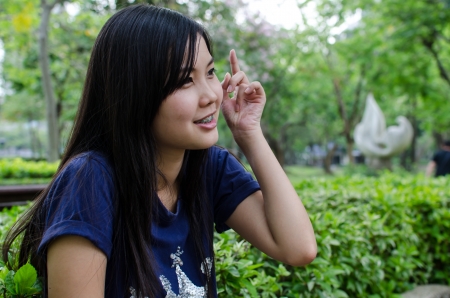 Lovely Chinese girl in the gradenの写真素材