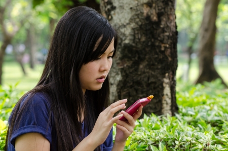 Lovely Chinese girl in the gradenの写真素材