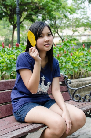 Lovely Chinese girl in the gradenの写真素材