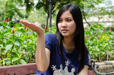 Lovely Chinese girl in the gradenの写真素材