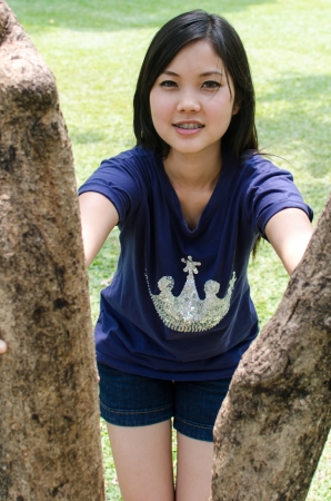 Lovely Chinese girl in the gradenの写真素材