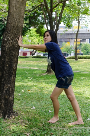 Lovely Chinese girl in the gradenの写真素材