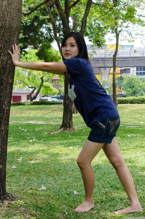 Lovely Chinese girl in the gradenの写真素材