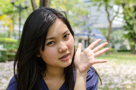 Lovely Chinese girl in the gradenの写真素材