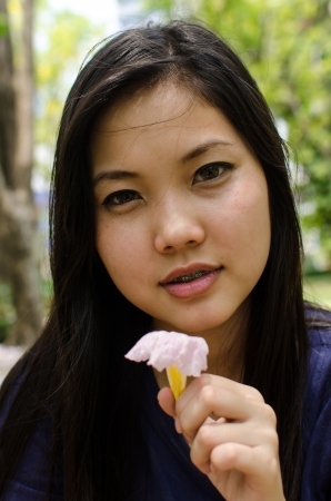 Lovely Chinese girl in the gradenの写真素材