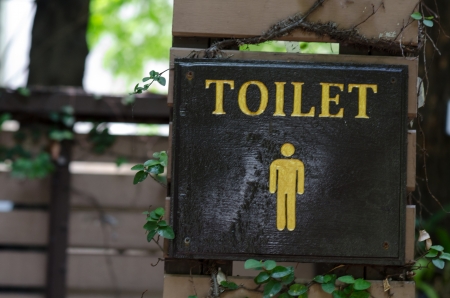 Male toilet board in the garden.の写真素材