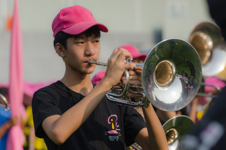 The pupils playing music instrument in bass band