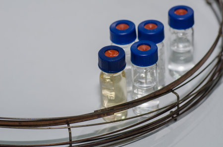 Analytical chemistry sample vial (blue screw cap) with column