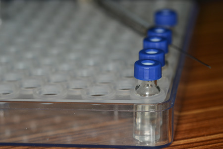 Sample vial are waiting for analysis in plastic trayの写真素材