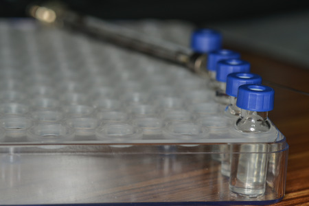 Sample vial are waiting for analysis in plastic trayの写真素材