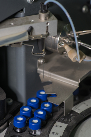 Sample vials in line waiting for analysis top viewの写真素材