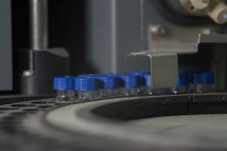 Sample vials in line waiting for analysis inside injection portの写真素材