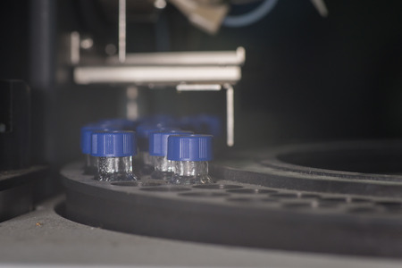 Sample vials in line waiting for analysis inside injection portの写真素材