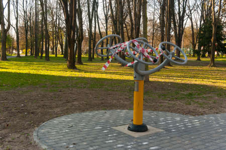 10 April 2020, Poland Krakow, Nowa Huta, Planty Bie?czyckie The outdoor gym located in the park was closed by an administrative decision because of the coronavirus.のeditorial素材