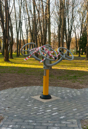 10 April 2020, Poland Krakow, Nowa Huta, Planty Bie?czyckie The outdoor gym located in the park was closed by an administrative decision because of the coronavirus.のeditorial素材
