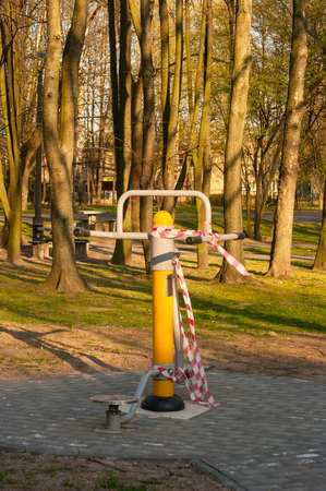 10 April 2020, Poland Krakow, Nowa Huta, Planty Bie?czyckie The outdoor gym located in the park was closed by an administrative decision because of the coronavirus.のeditorial素材