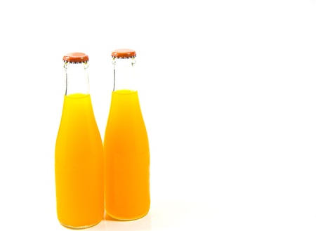 Two bottles of orange juice isolated on white backgroundの写真素材