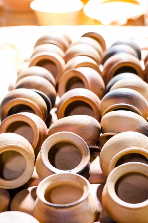 There are many clay pots on the ground.の写真素材
