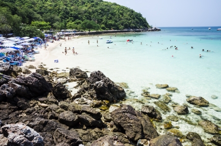 People playing in the sea on a hot summer's dayの写真素材