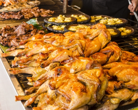 Many grilled chickens on the grill の写真素材