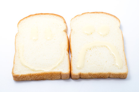 Sliced white bread on white background の写真素材