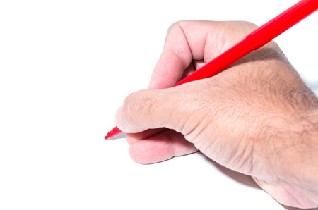 Hand holding pen on white background.の写真素材