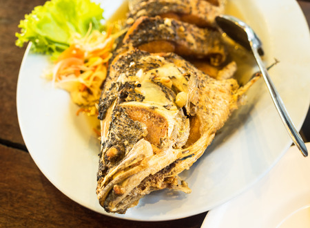 Fried Fish served with side saladの写真素材