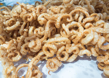 Crispy deep fried pork skin or pork rind for sale.の写真素材