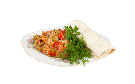 Canned vegetable salad with fresh greens and pita bread on a plateの写真素材