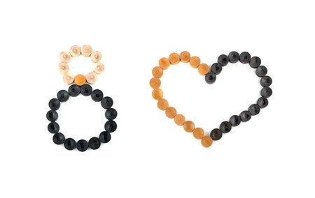 Number eight and a symbol of the human heart, lined with colorful wooden swords on a white...