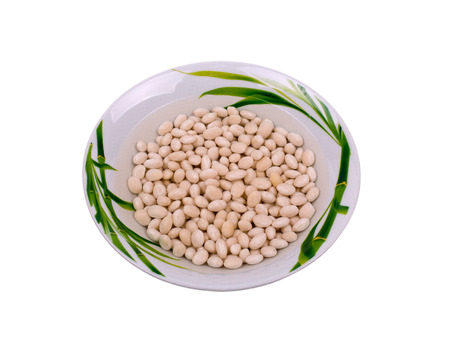 Fruits beans in water in a bowl, isolated on white backgroundの写真素材