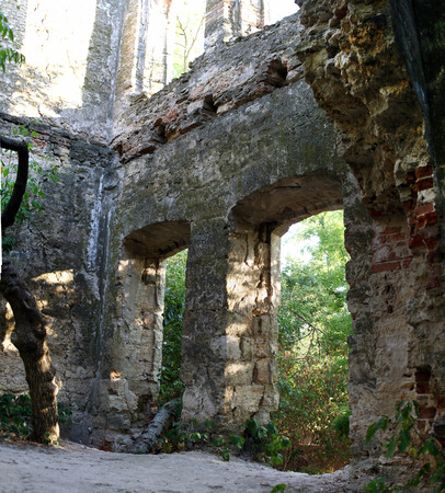 General view of the destroyed wall of the old building in the summer timeの写真素材