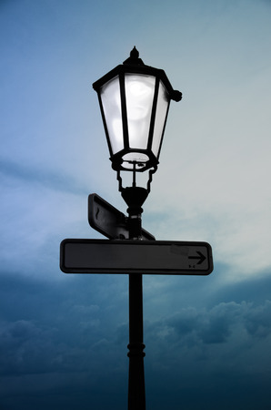 Antique lamp with white light in front of the cloudy skyの写真素材