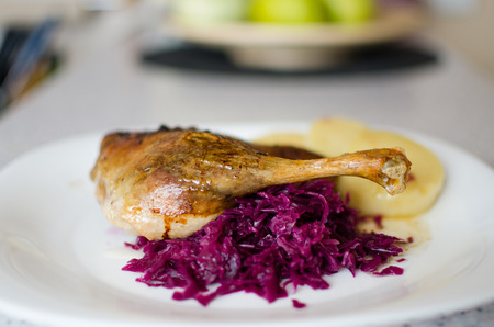 Duck with cabbage and dumplings, baked duck leg, baked duck with  red cabbage - shallow of depthの写真素材