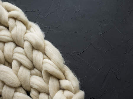 Cozy composition, closeup merino wool blanket, warm and comfortable atmosphere. Knit backgroundの写真素材