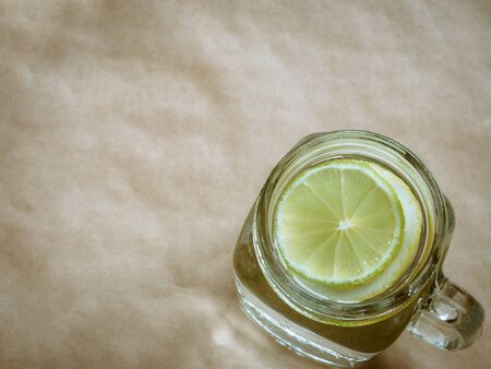 Lemonade with lemon on light background. Zero waste conceptの写真素材