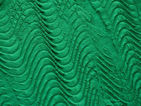 Spirulina algae tablets on green background from top view.の写真素材