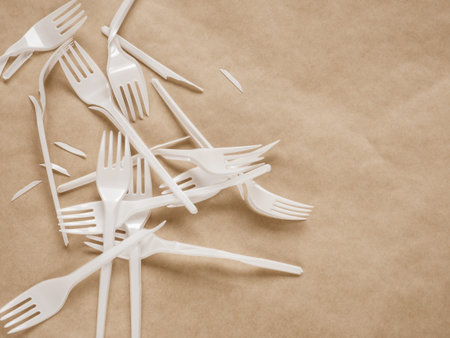 Plastic forks garbage on light background. Plastic free concept.