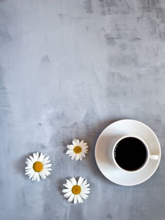 Cup of coffee on gray table in minimal style, Top view. Business team work meeting conceptの写真素材
