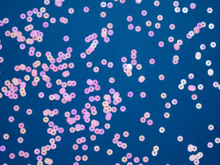 Sparkle pink circle confetti on blue background. Holiday, event, sale.